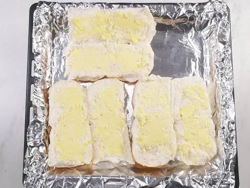 spread butter on the dinner rolls