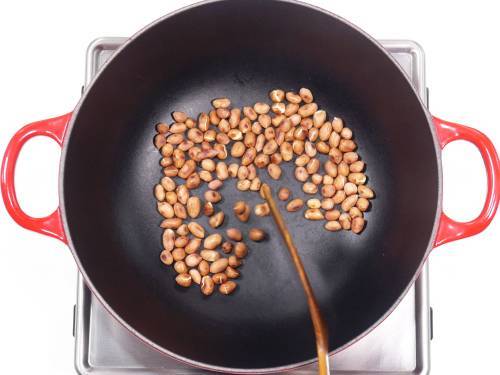 roasted peanuts cooling in a pan