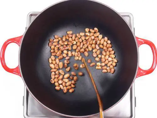 roasted peanuts cooling in a pan