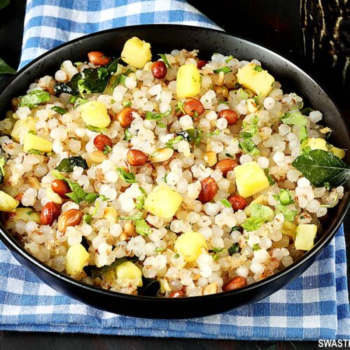 sabudana khichdi served in a black plate