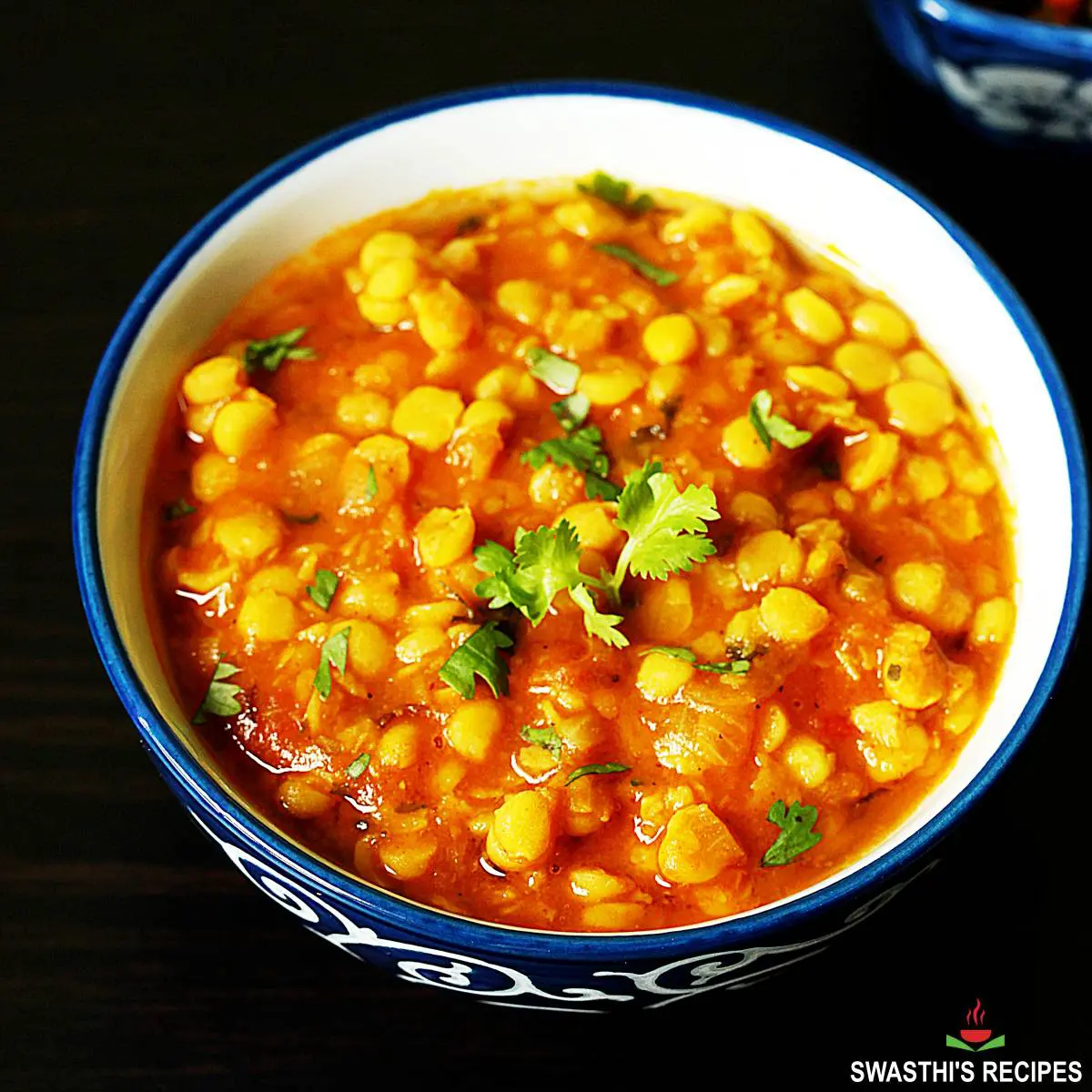 chana dal served in a blue and white bowl