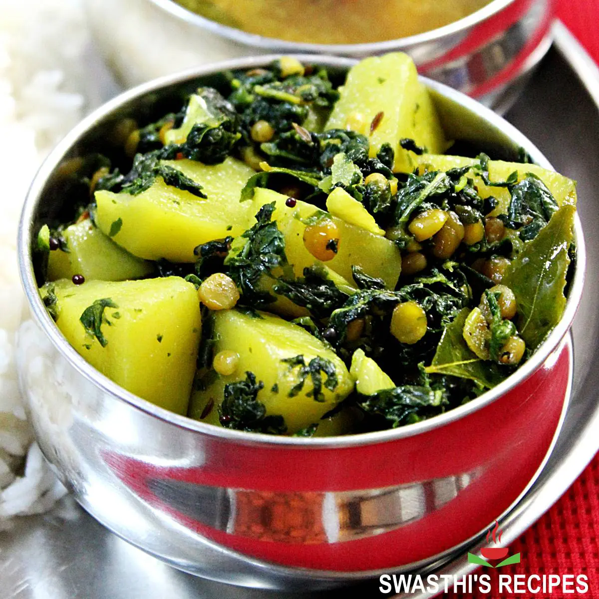 drumstick leaves stir fry served in a steel bowl