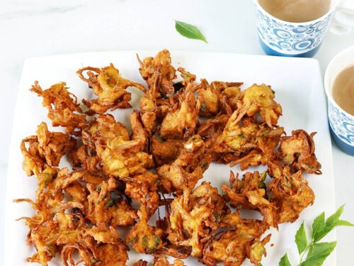 onion pakoda served in a white plate