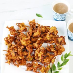 onion pakoda served in a white plate