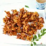 onion pakoda served in a white plate