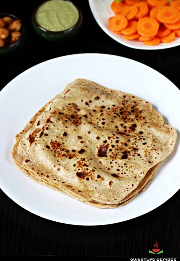 paratha served with chutney and vegetables