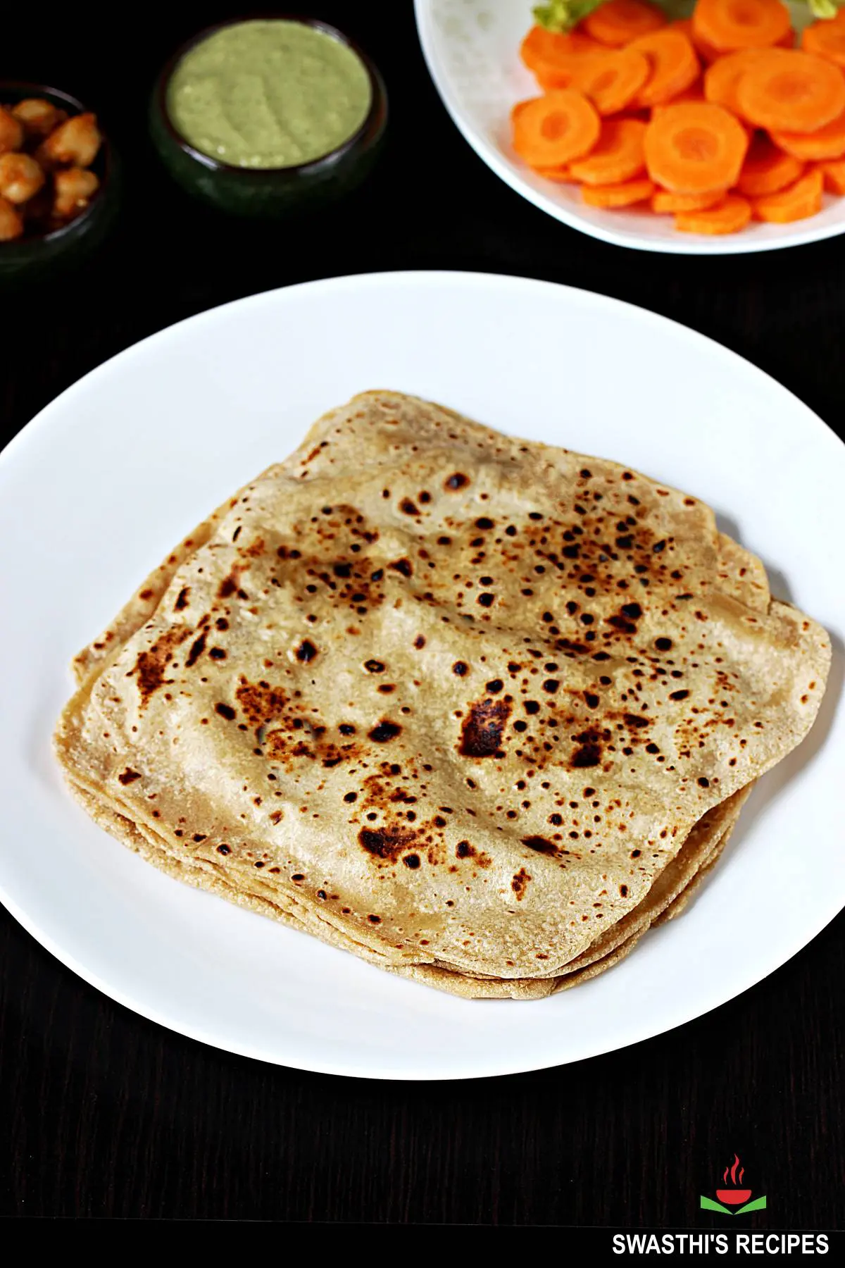 paratha served with chutney and vegetables