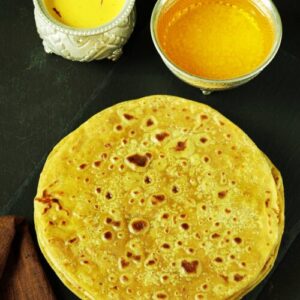 puran poli served in a black plate