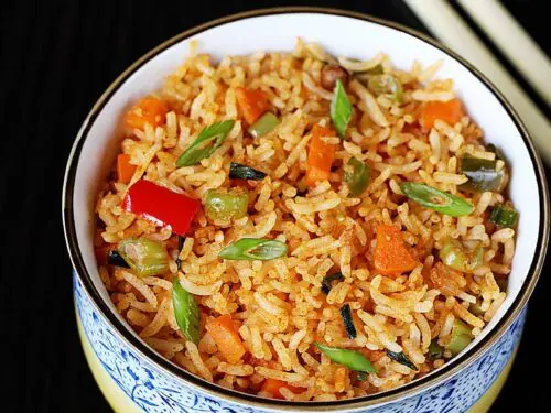 schezwan fried rice served in a white bowl