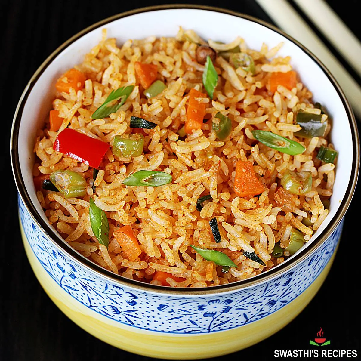schezwan fried rice garnished with spring onions
