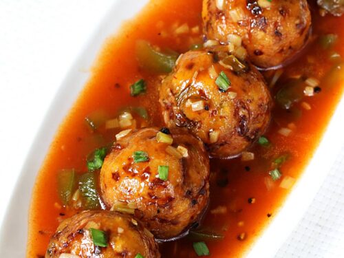 veg manchurian served in a white plate