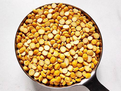 chana dal ready to be cooked in a measuring bowl