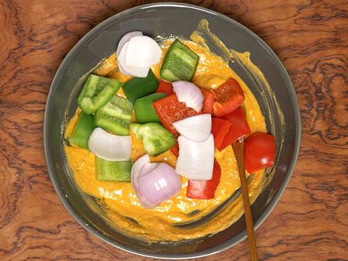 bell peppers being added to the marinade