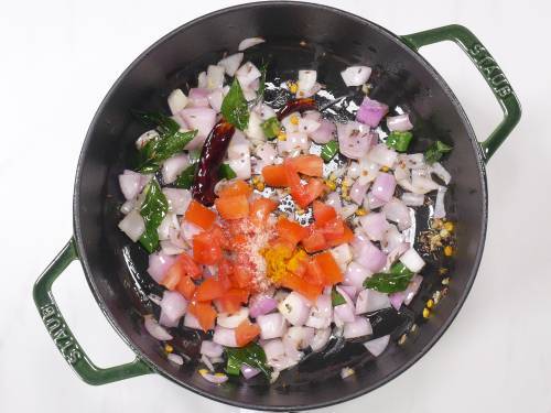 tomatoes and salt added to pan