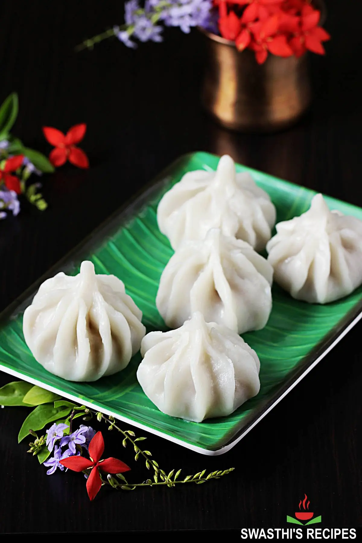 ukadiche modak offered in a green plate during Ganesh Chaturthi pooja