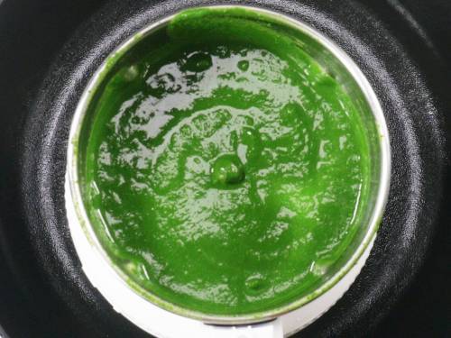 pureed spinach in a grinder