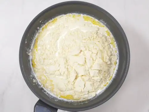 add milk powder to the pan for burfi