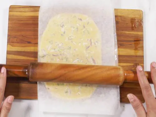 rolling burfi mixture with a rolling pin