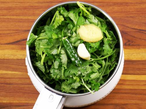 coriander, green chilies, ginger garlic in a grinder to make mint chutney