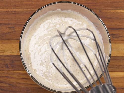 whisk yogurt in a bowl to make mint chutney