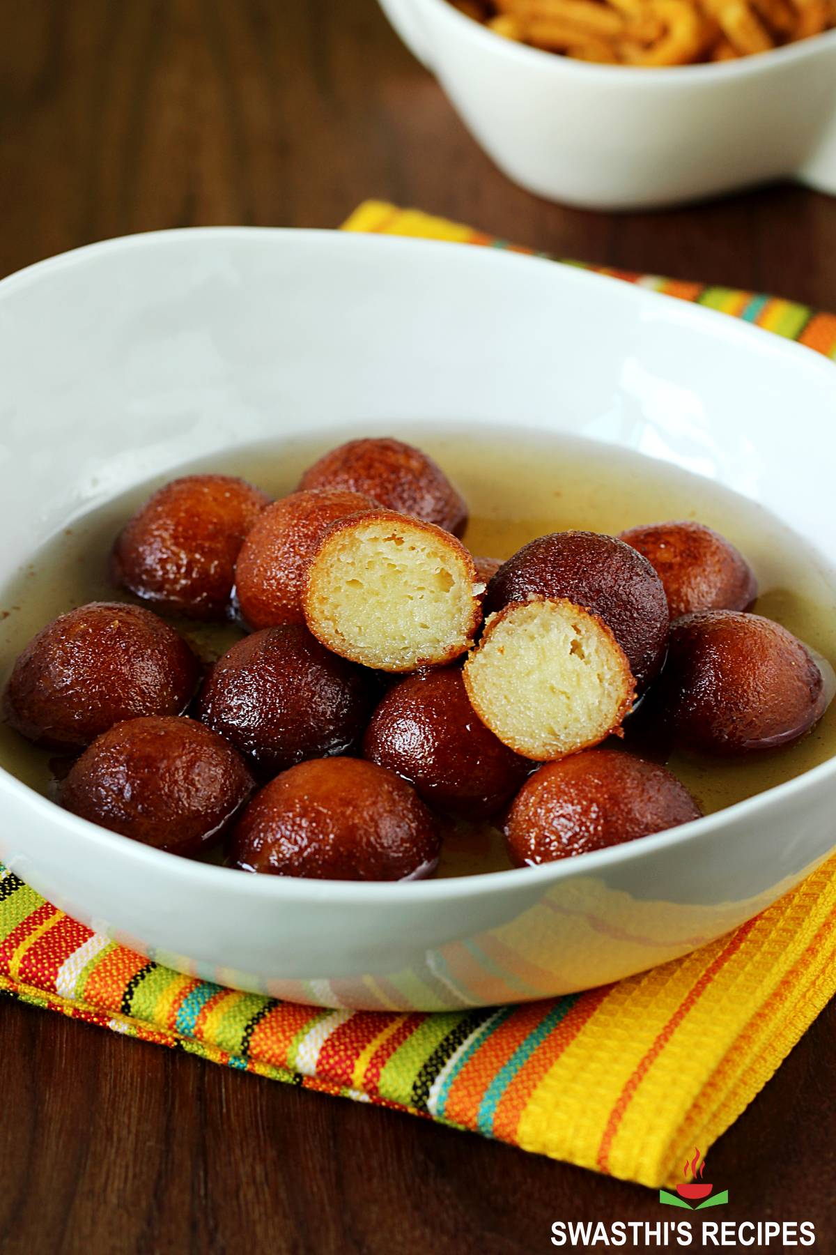 Gulab jamun with khoya served in a white bowl