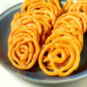 Jalebi served in a blue plate