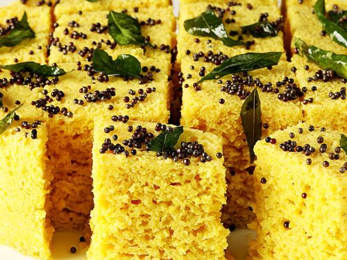Dhokla also known as khaman dhokla served in a white tray