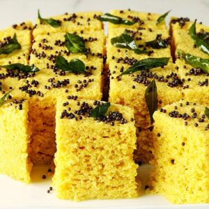 Dhokla also known as khaman dhokla served in a white tray