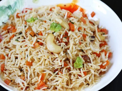 carrot rice recipe made with cooked rice, spices, herbs and carrots