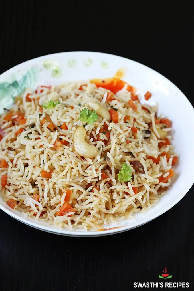 carrot rice recipe made with cooked rice, spices, herbs and carrots