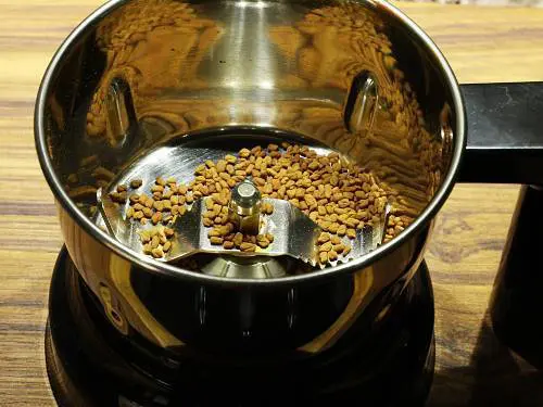 methi seeds in a grinder