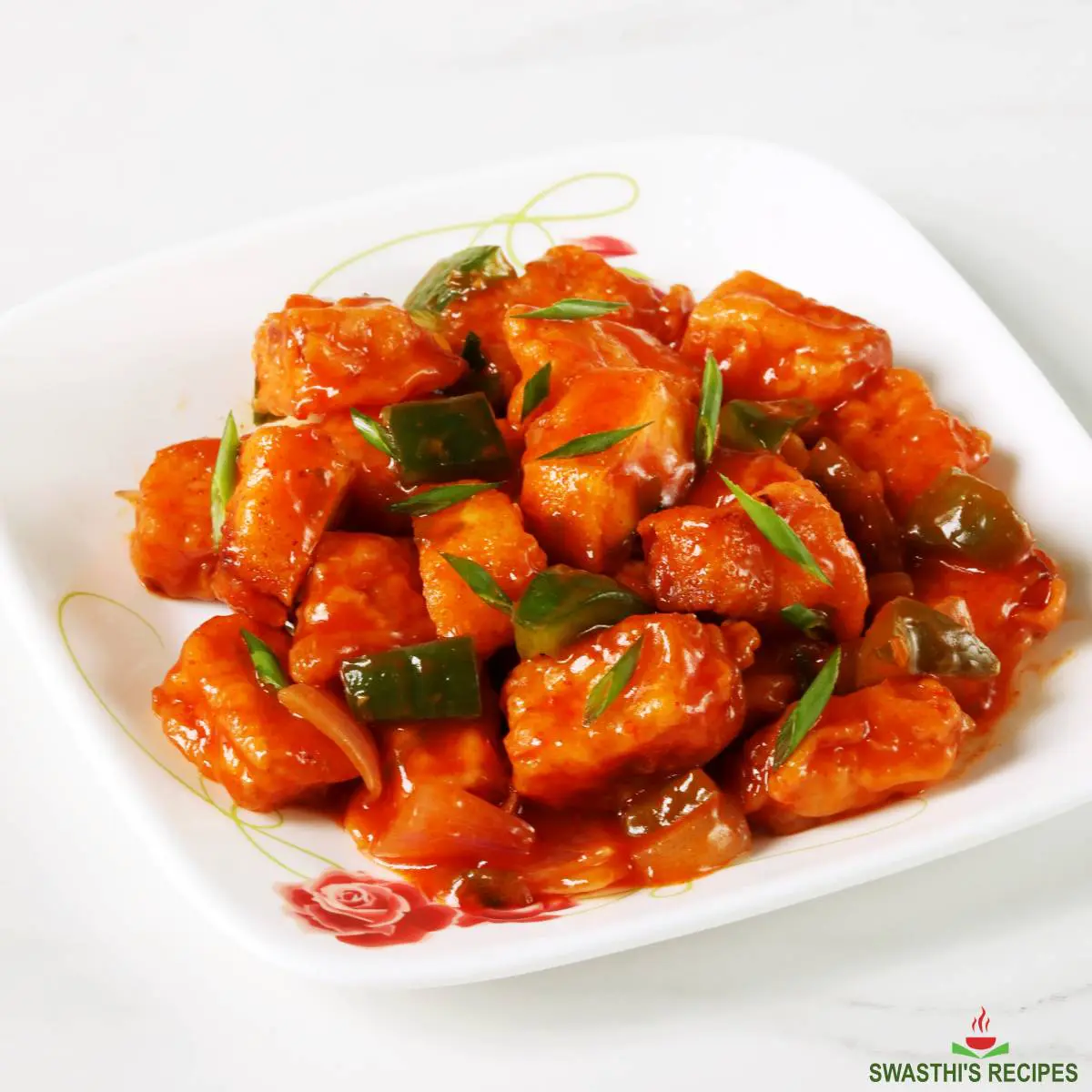 Chilli paneer served in white plate