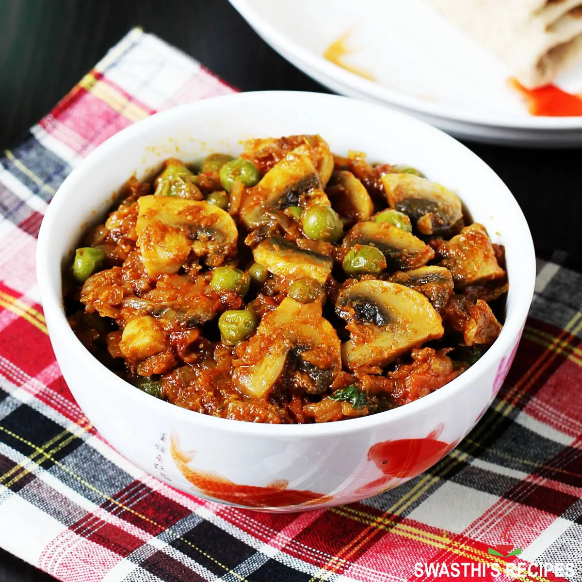 Matar Mushroom is mushrooms and peas cooked in a spicy onion tomato masala