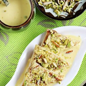Shahi tukda also known as shahi tukra served in a white plate