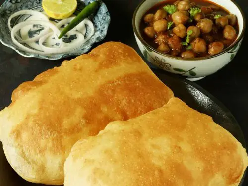 Bhatura, a popular Indian fried bread served in a black plate
