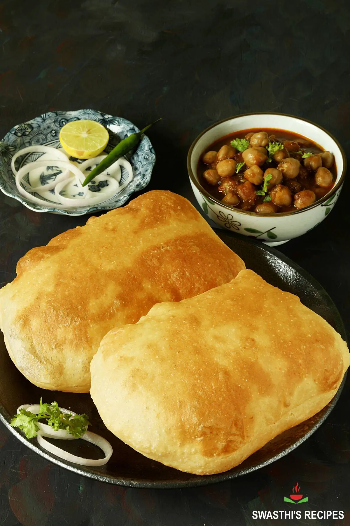 Bhatura, a popular Indian fried bread served in a black plate