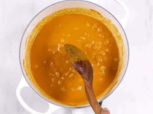 mixing the chickpea with masala
