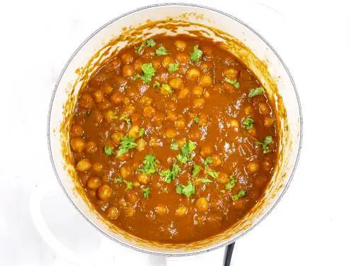 Chana masala ready to be served, garnished with coriander leaves