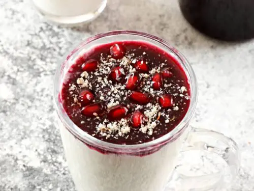 pomegranate molasses served as a topping over panna cotta