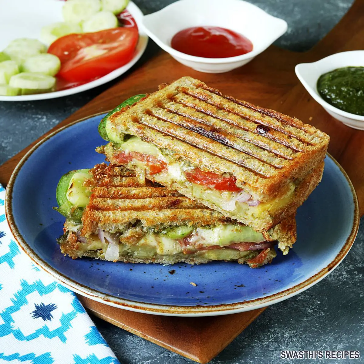 Veg Grilled Sandwich made with vegetables, cheese, chutney and spices