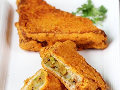 Bread pakora served in a white plate