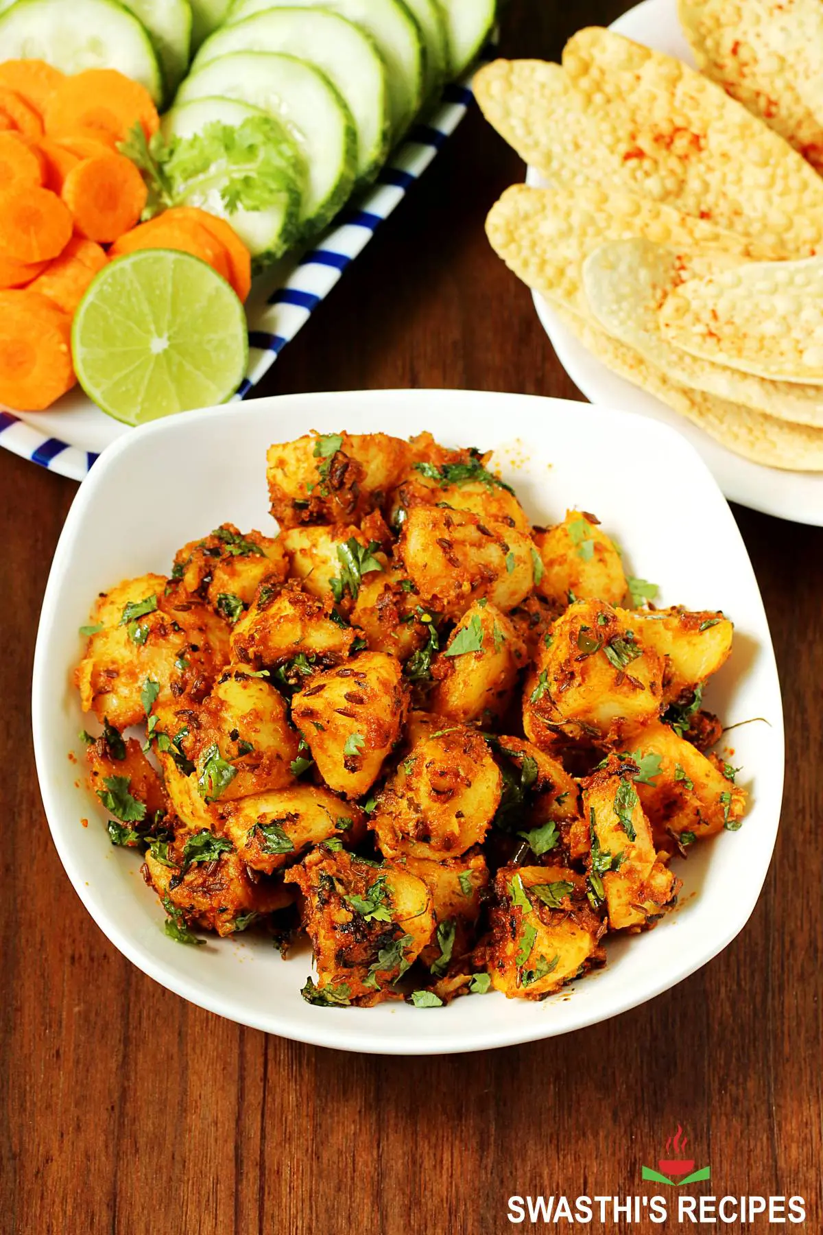Jeera Aloo served in a white bowl