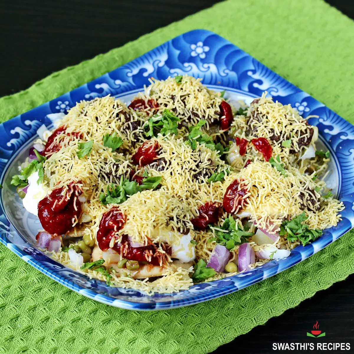 Papdi chaat served in a blue plate