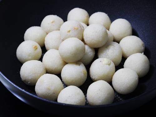 shape the mixture to form coconut ladoos