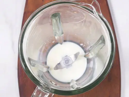 milk in a blender to make Oreo shake