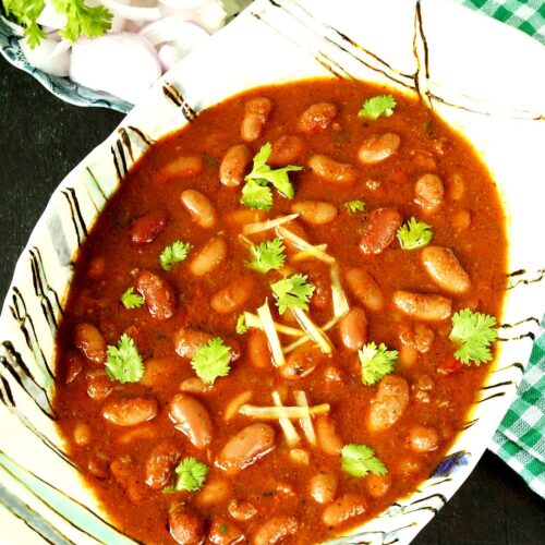 Rajma recipe made with red kidney beans, spices, onions and tomatoes