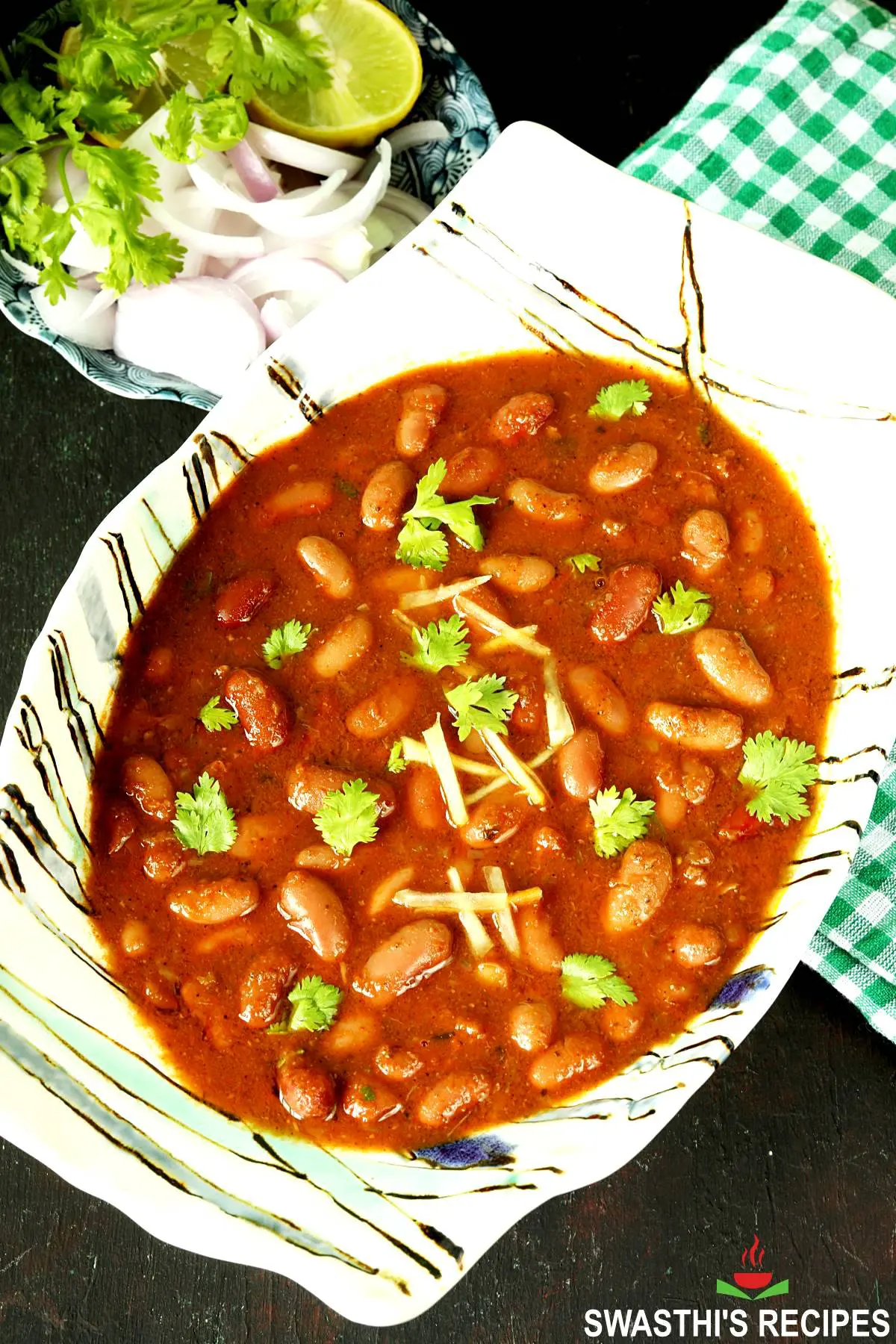 Rajma recipe made with red kidney beans, spices, onions and tomatoes