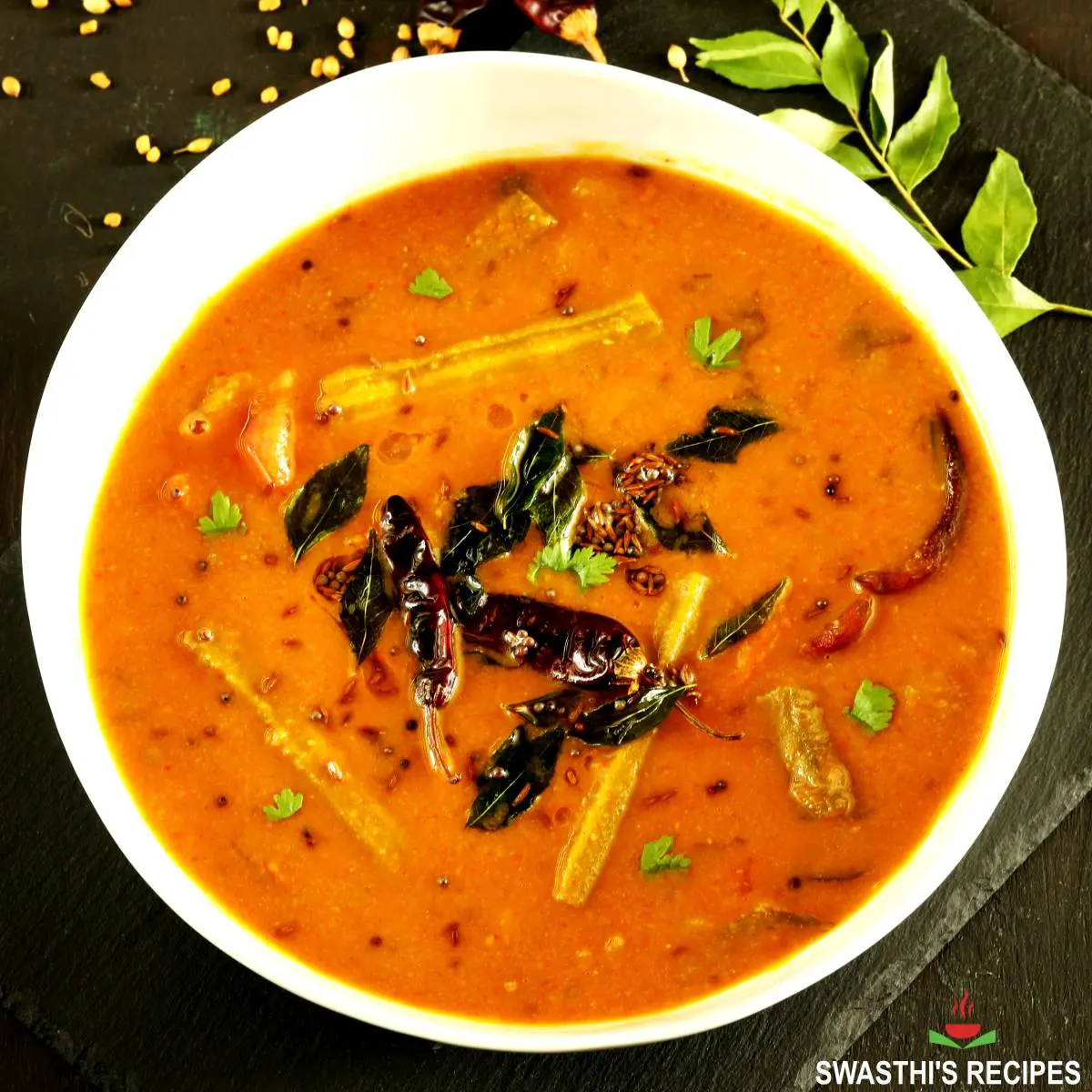 Sambar recipe made with lentils, spices, vegetables and herbs