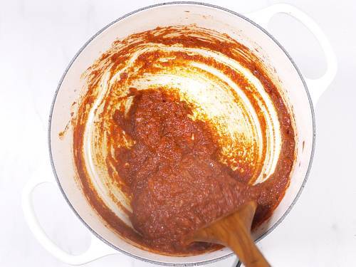 cooking tikka masala in a pan