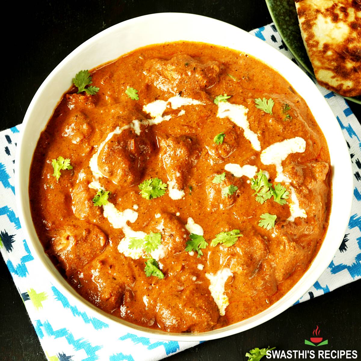 Chicken tikka masala served in a white bowl